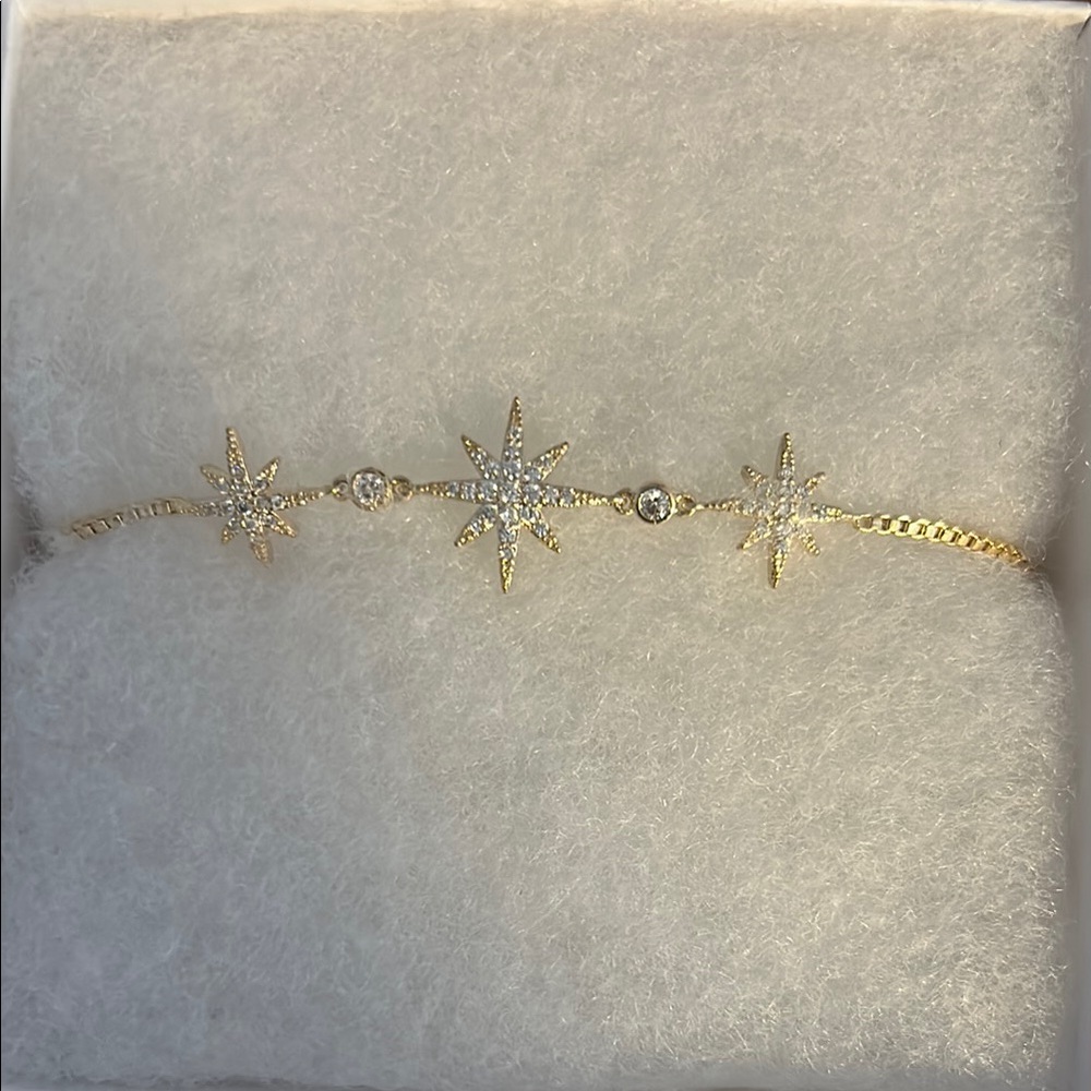 Intricate Gold Tone Starburst Bracelet with Sparkling Accents